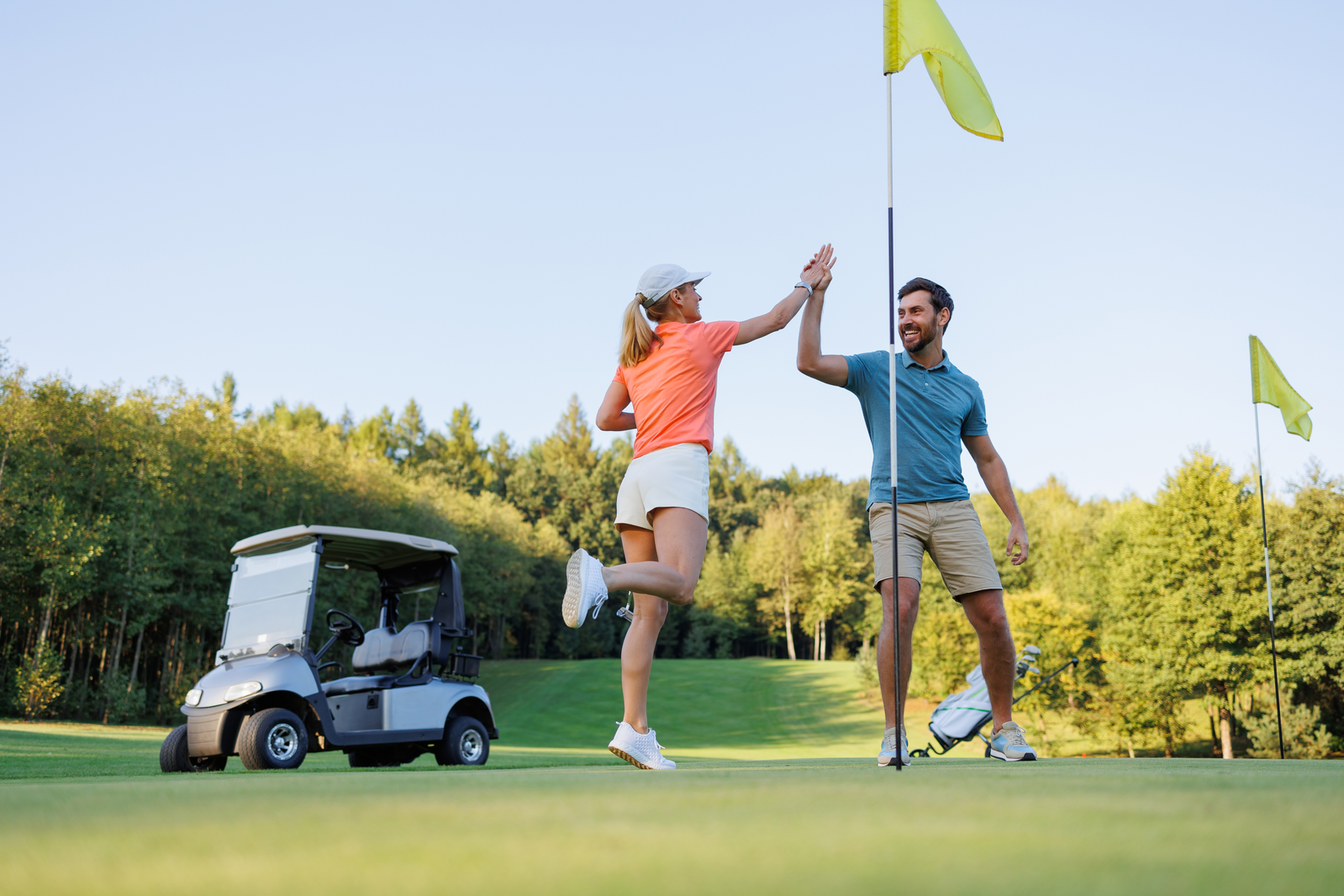 high fives on golf course