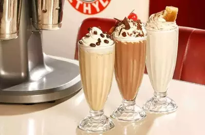 Delicious milkshakes on a table.