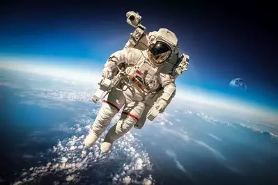 An astronaut floating above Earth.