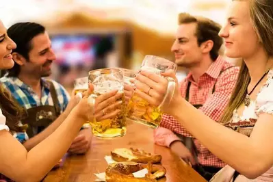 Friends drinking beer at Oktoberfest.