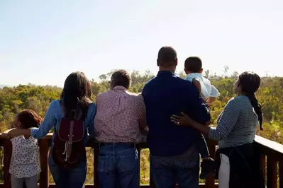 Large family enjoying mountain views from the deck.