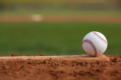 A baseball on a pitcher's mound.