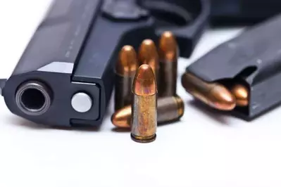 Gun with ammo sitting on a table at the shooting range in Sevierville