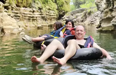 Family tubing down a river