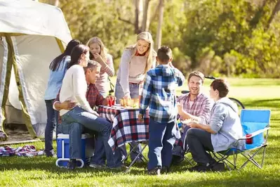family camping and eating together