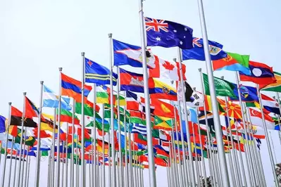 National flags of countries flying in the air