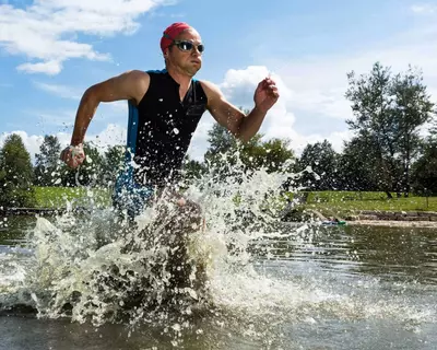 Triathlete running out of water during triathlon