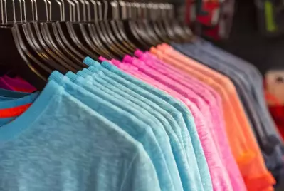 tshirts hanging on rack