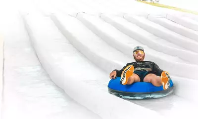 guy snow tubing at Smoky Mountain Snowpark