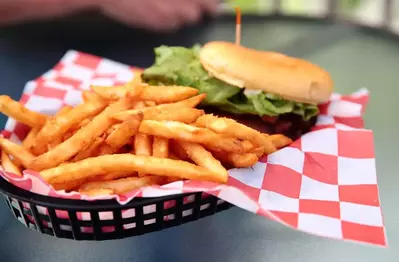 burger in basket with fries