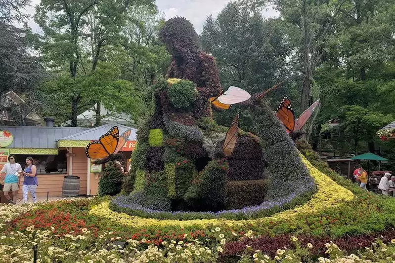 coat of many colors flower sculpture