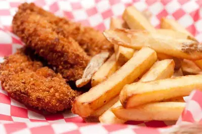 chicken tenders and fries in basket