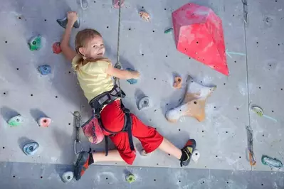 kid climbing rock wall
