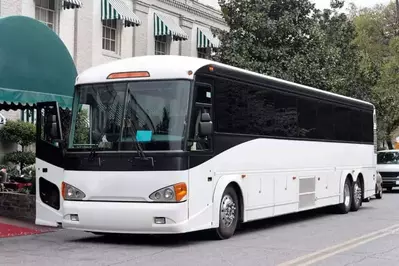 tour bus parked outside building