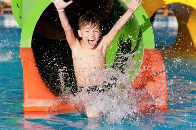 boy on water slide during summer in gatlinburg