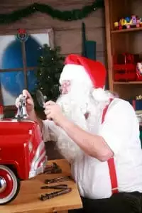Santa in his workshop making toys