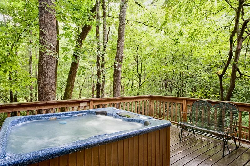 Relax in the hot tub on the deck of this affordable vacation rental