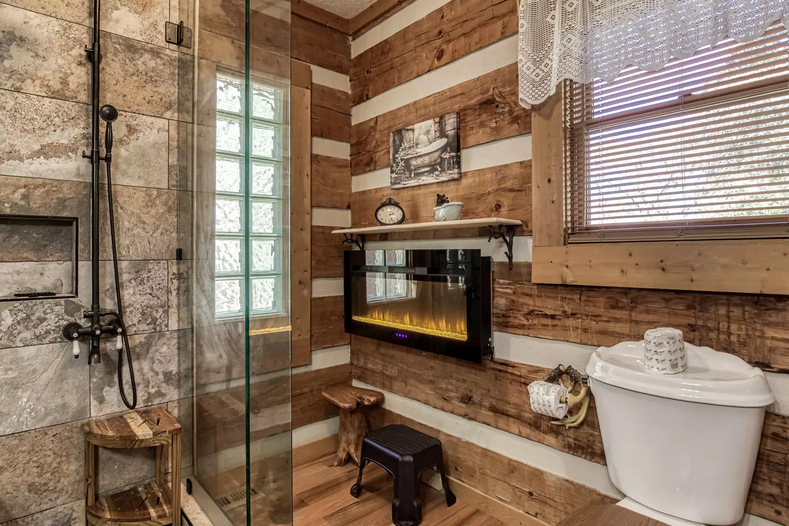 4 Paws Lodge master bathroom with year round electric fireplace
