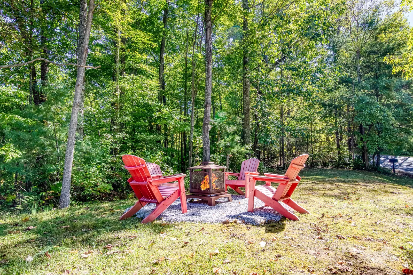 Blue Sky fire pit in a wooded setting