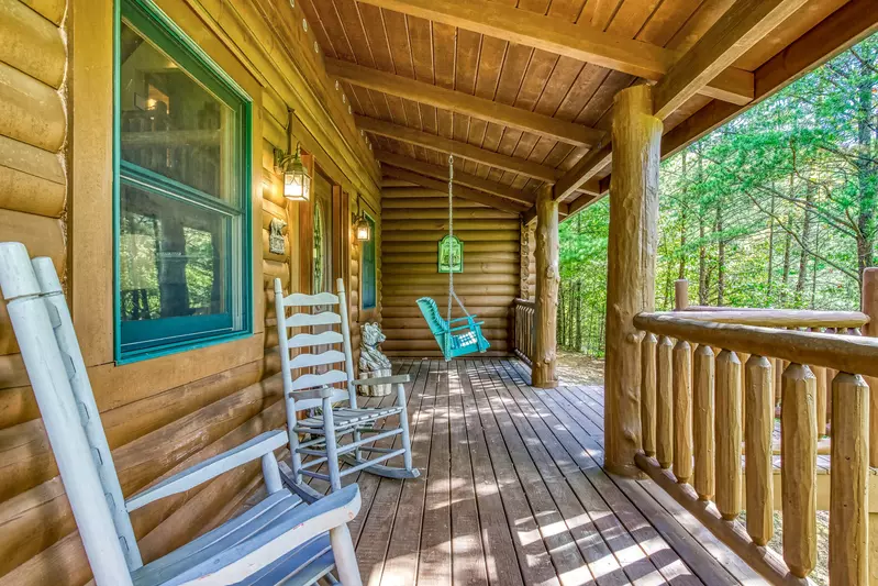Blue Sky covered front deck with rocking chairs