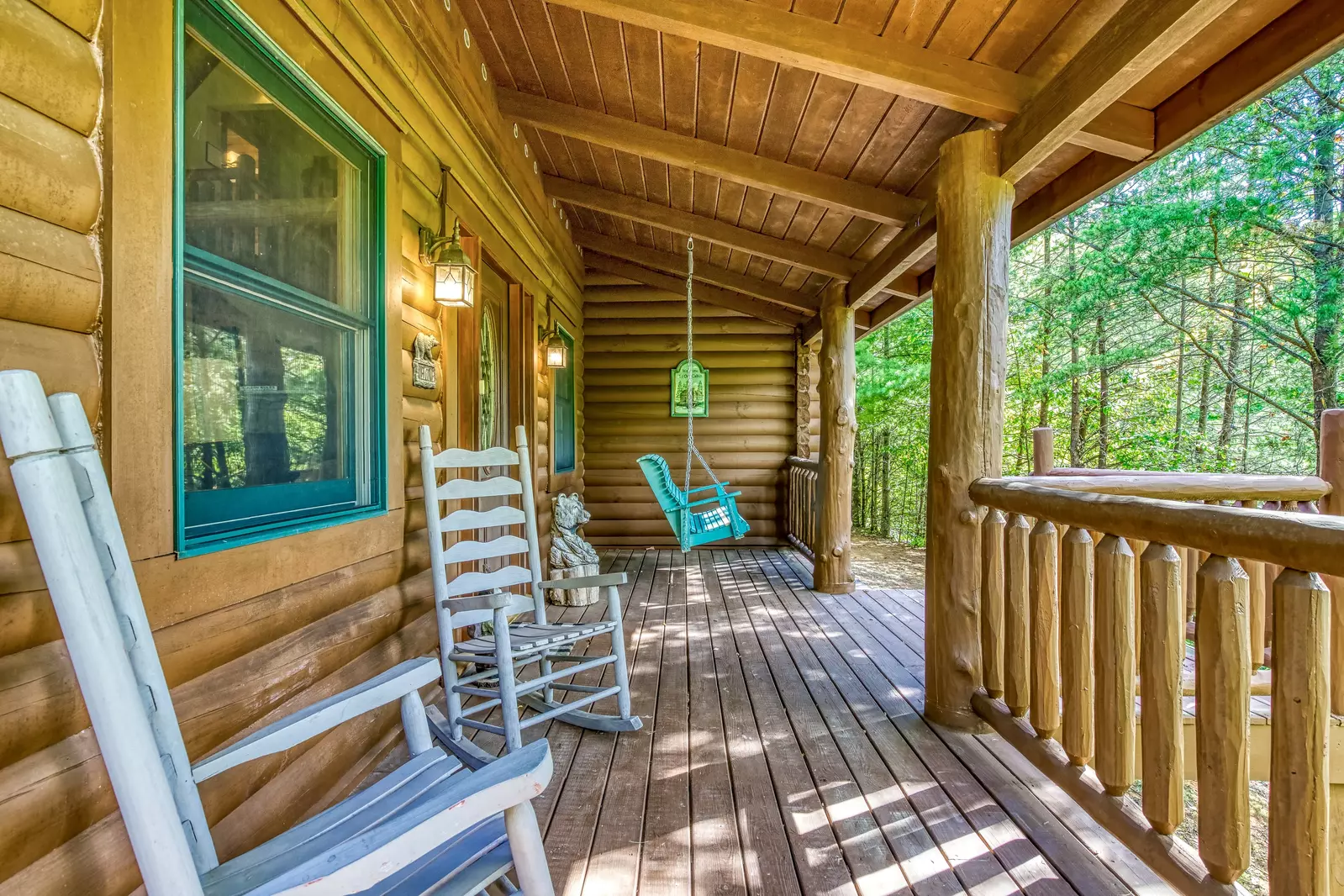 Blue Sky covered front deck with rocking chairs