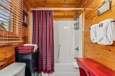 Full bathroom with shoer/tub combo
