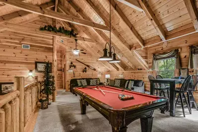 Game room with pool table on second level