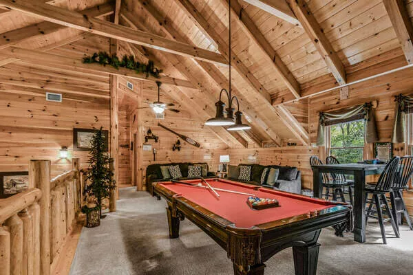 Game room with pool table on second level