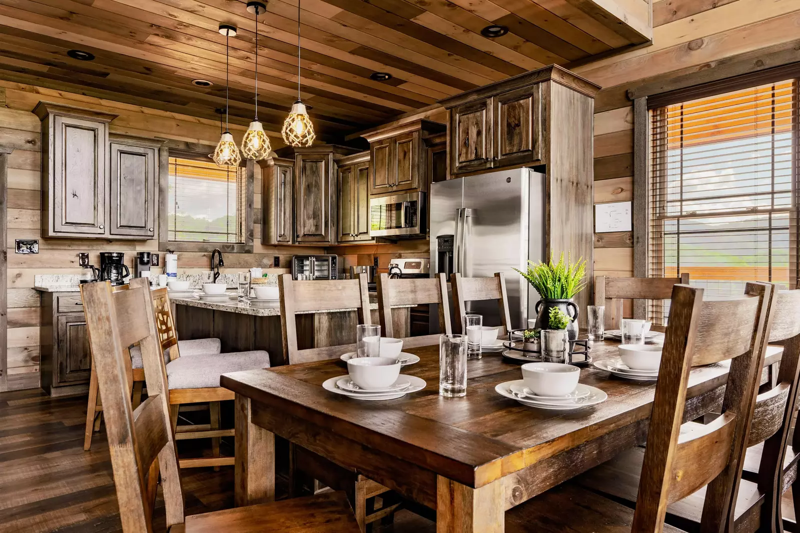 Our 8-persons dining table with our kitchen beyond.