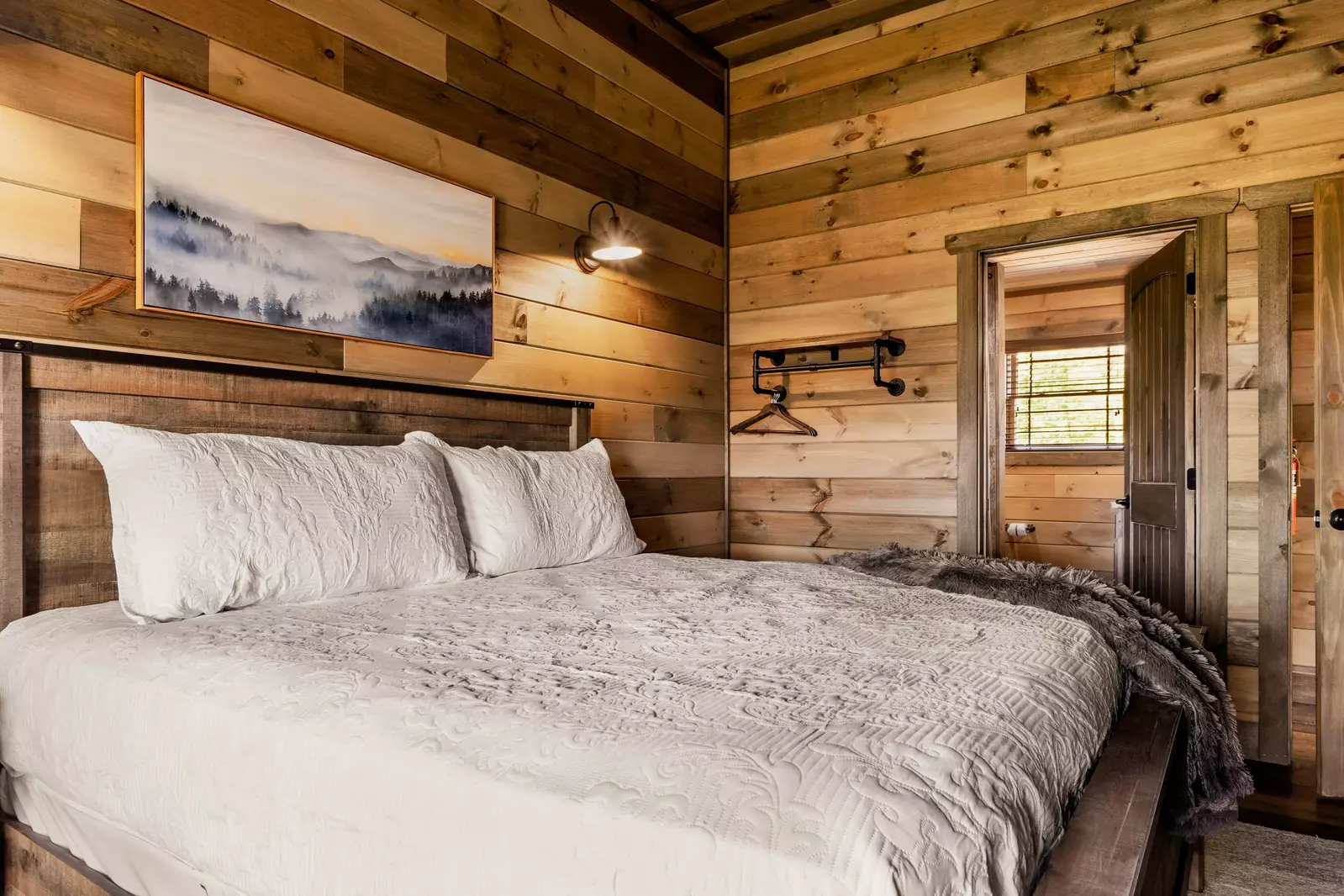 Another view of upstairs level King bedroom with a view.   Private bathroom.