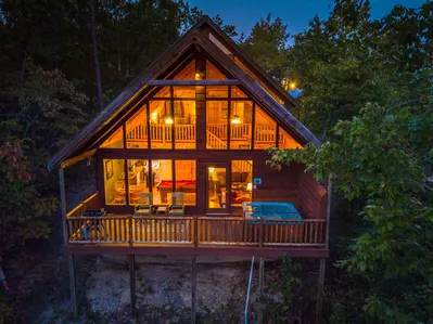 A Walk in the Clouds floor to ceiling windows and Covered Back Deck
