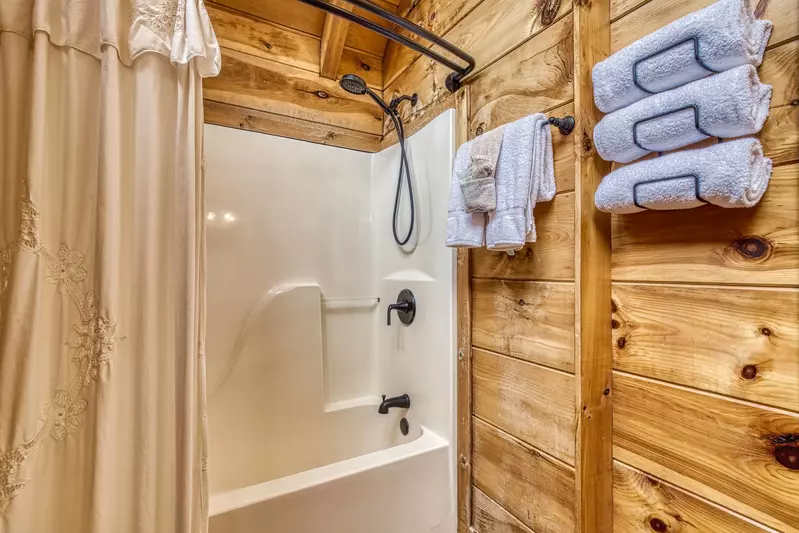 A Walk in the Clouds bathroom with tub/shower combo