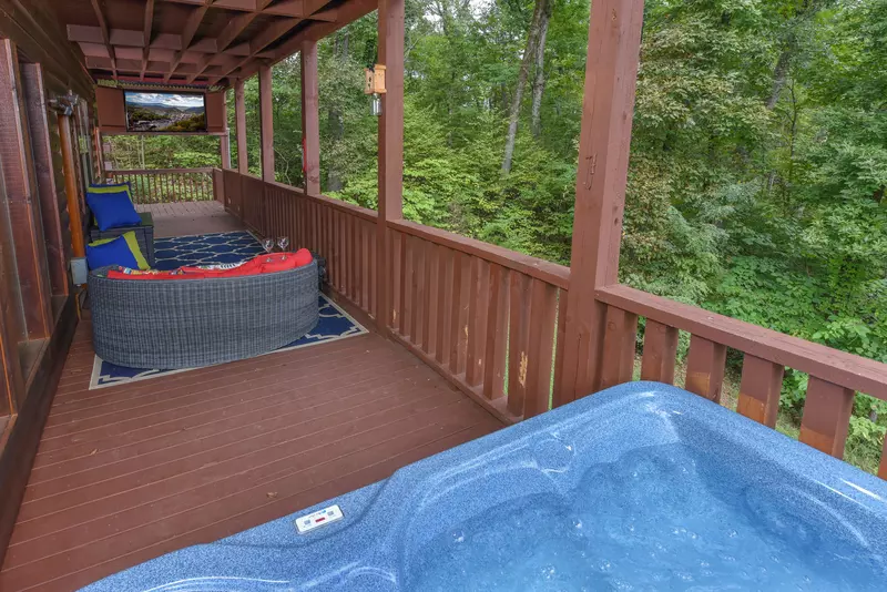 Antler Run covered wrap around deck with hot tub