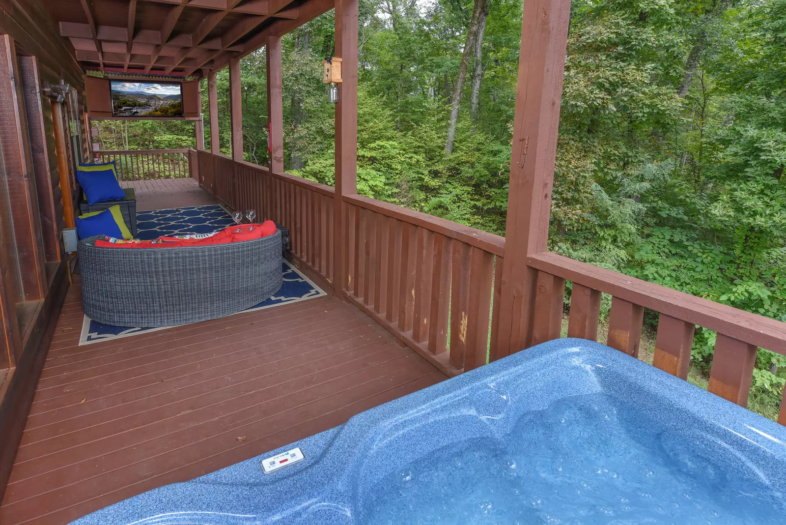 Antler Run covered wrap around deck with hot tub
