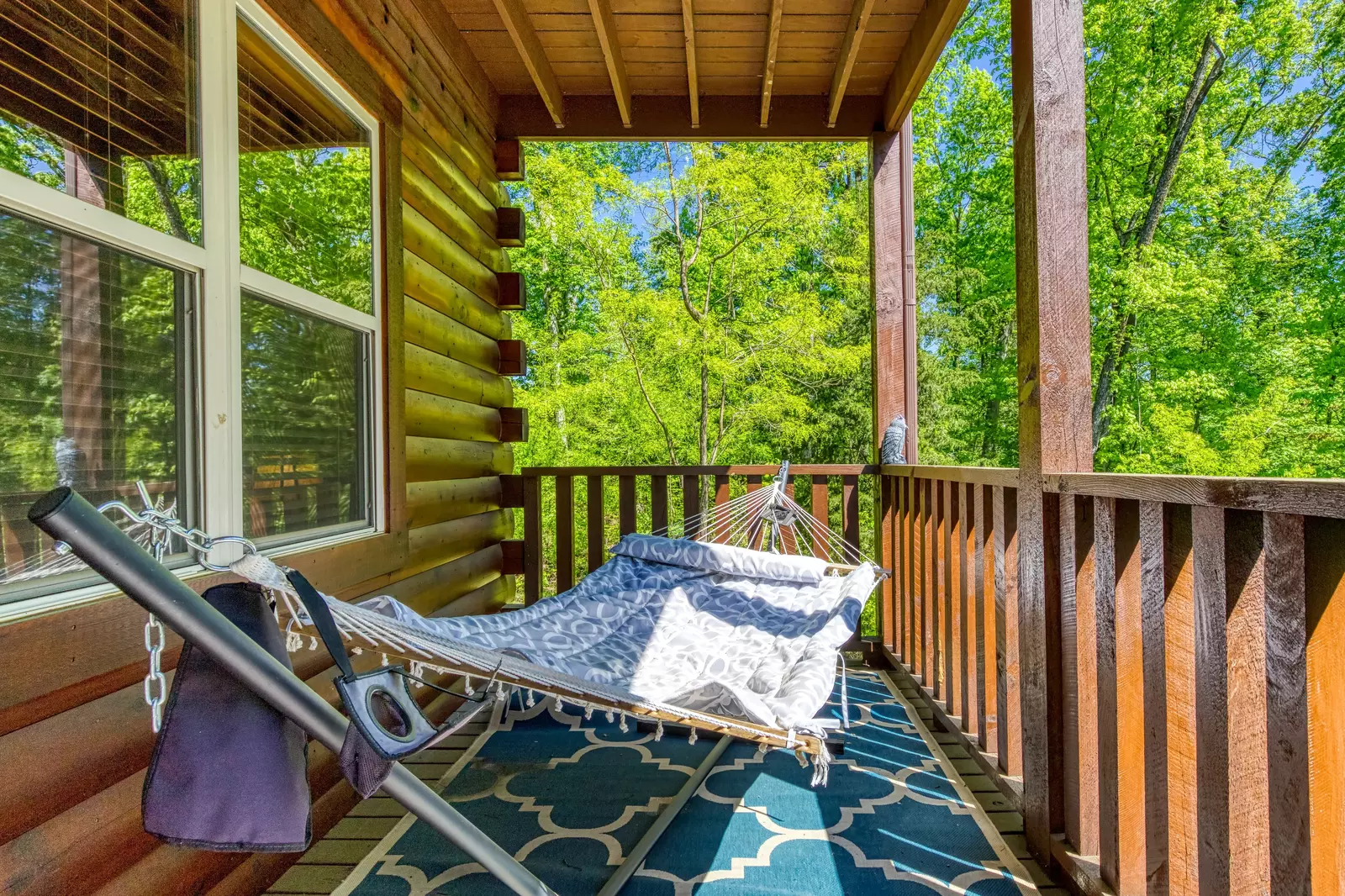 Antler Run second floor wrap around covered deck with hammock