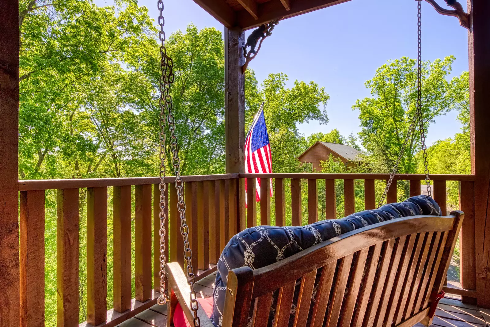 Antler Run third floor covered wrap around deck with swing