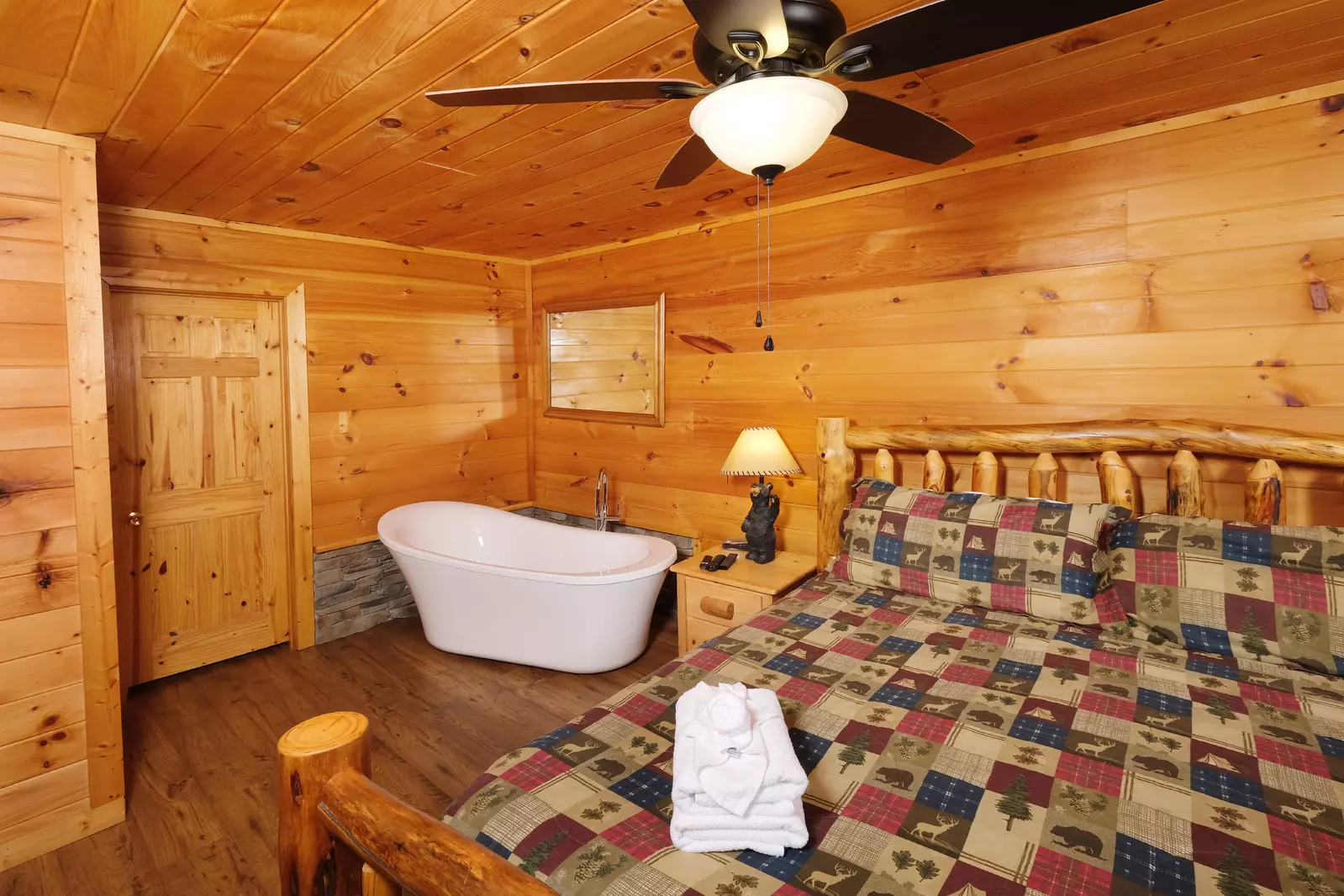 Bearadise Mountain Lodge upper level bedroom with spa soaking tub