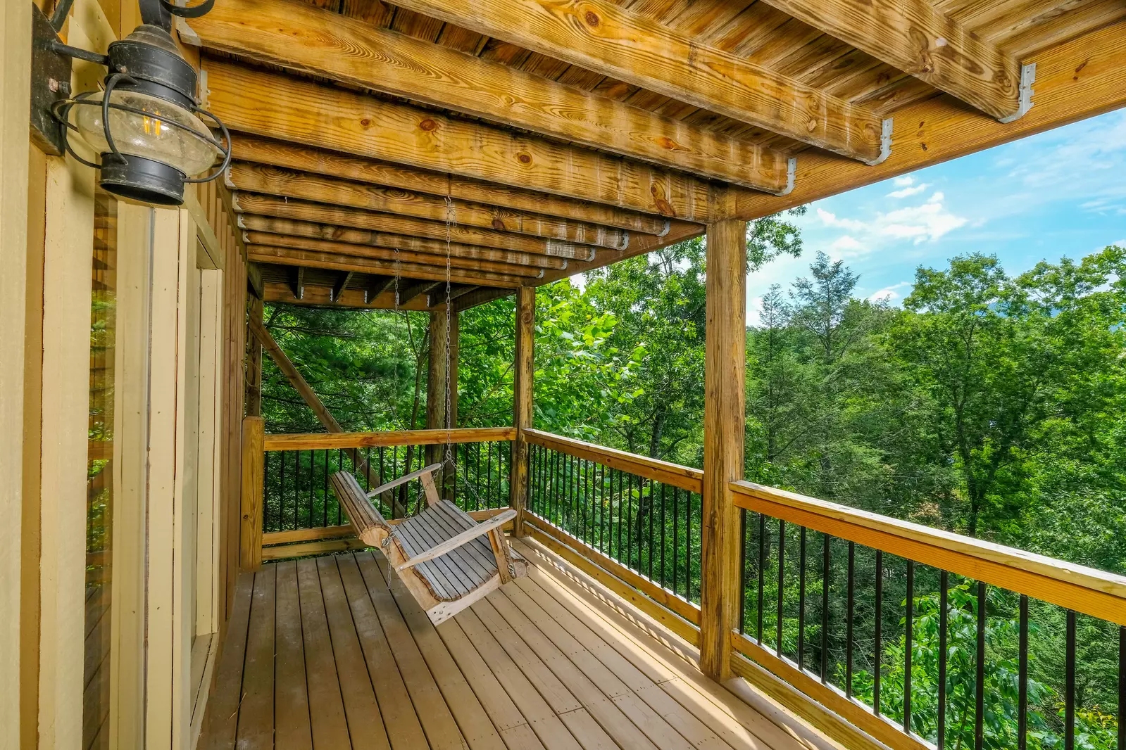 Bearadise Mountain Lodge covered back deck with swing