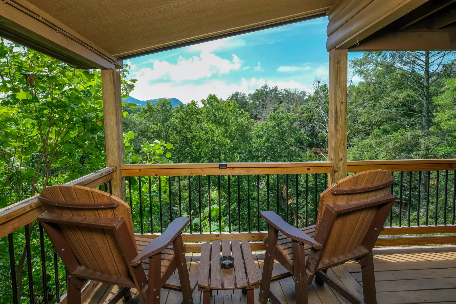 Bearadise Mountain Lodge entry deck with high top table and chairs
