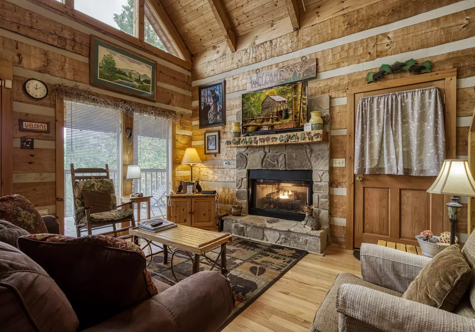 Buck Naked living room with stone encased fireplace