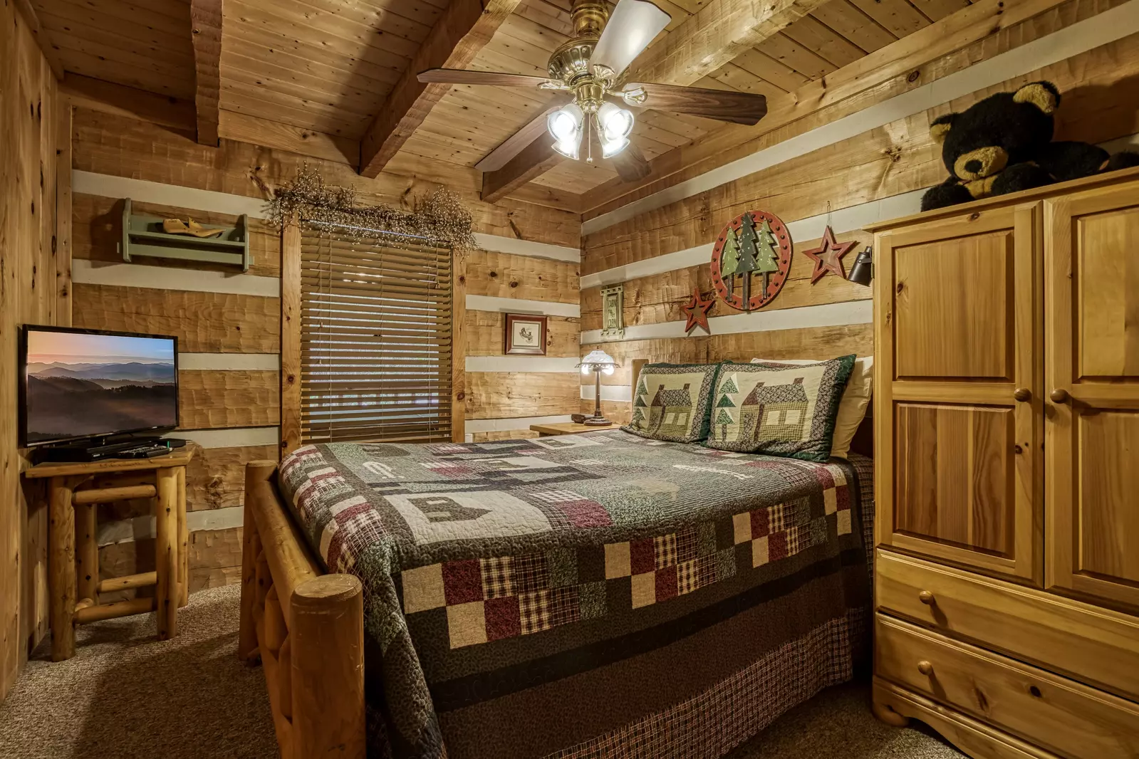 Buck Naked main level bedroom with queen size bed
