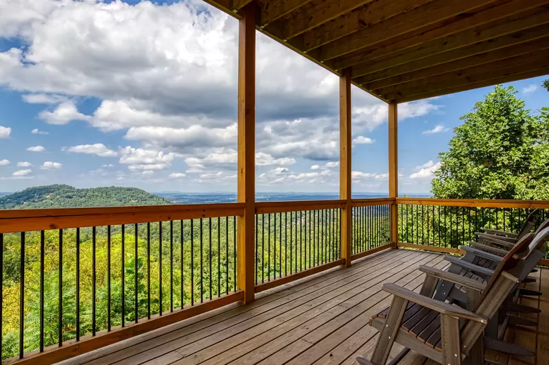 Chasing Views covered back deck with rocking chairs