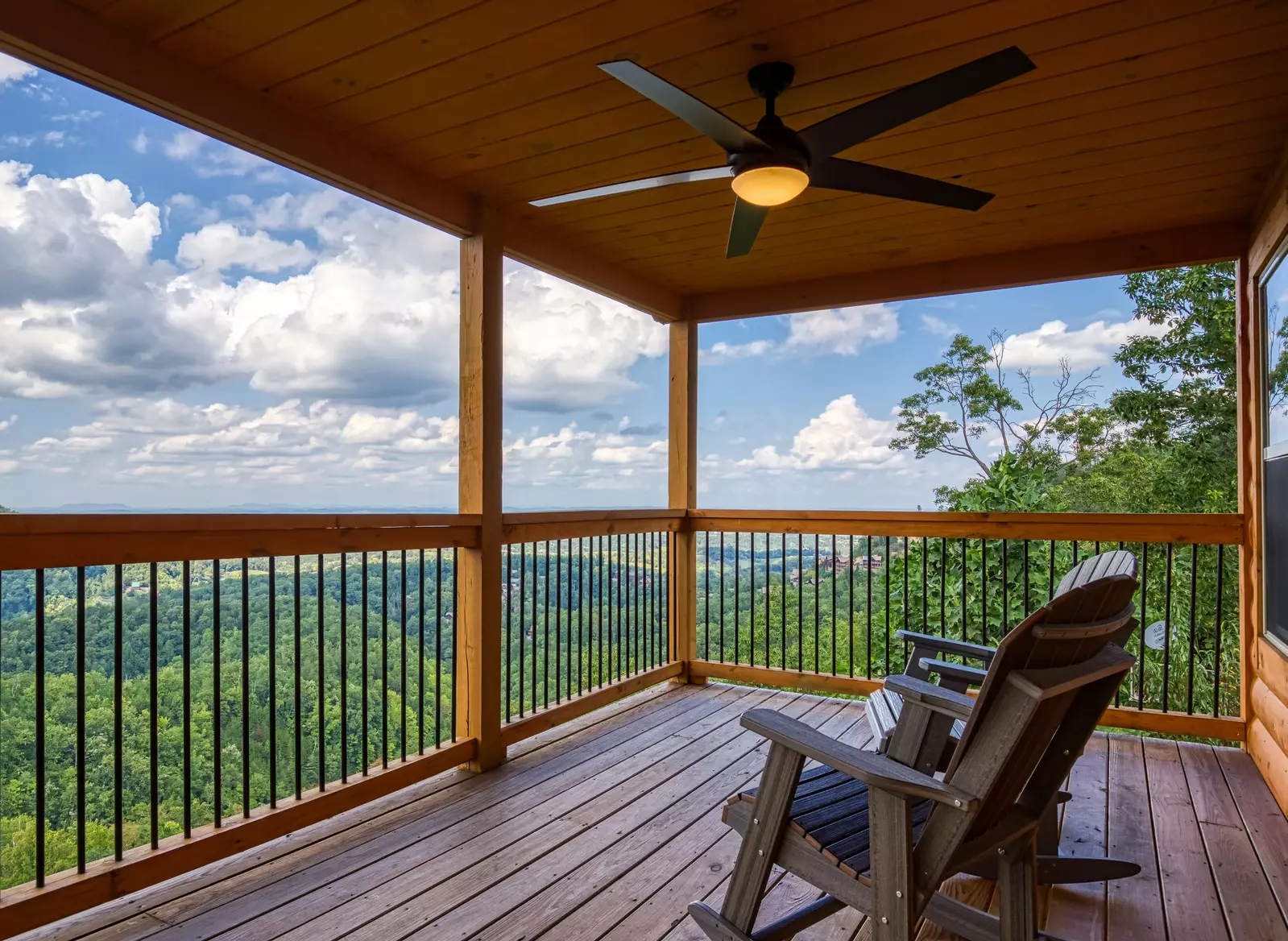 Chasing Views covered back deck with rocking chairs