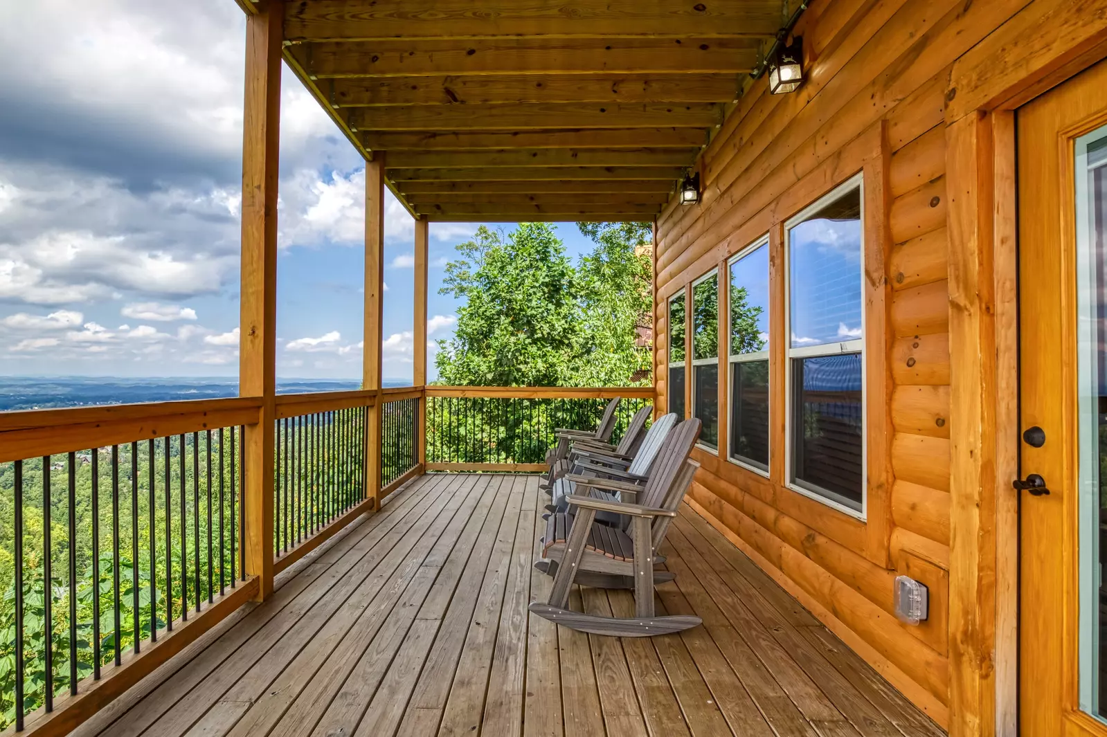 Chasing Views covered back deck with rocking chairs