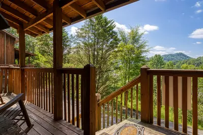Country Charm covered entry deck with mountain views