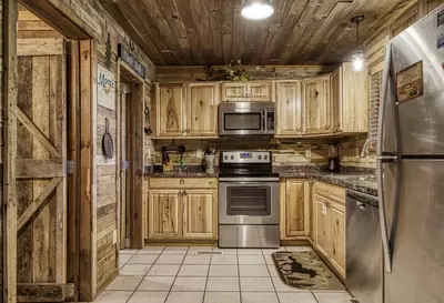 Country Charm fully furnished kitchen with granite countertops