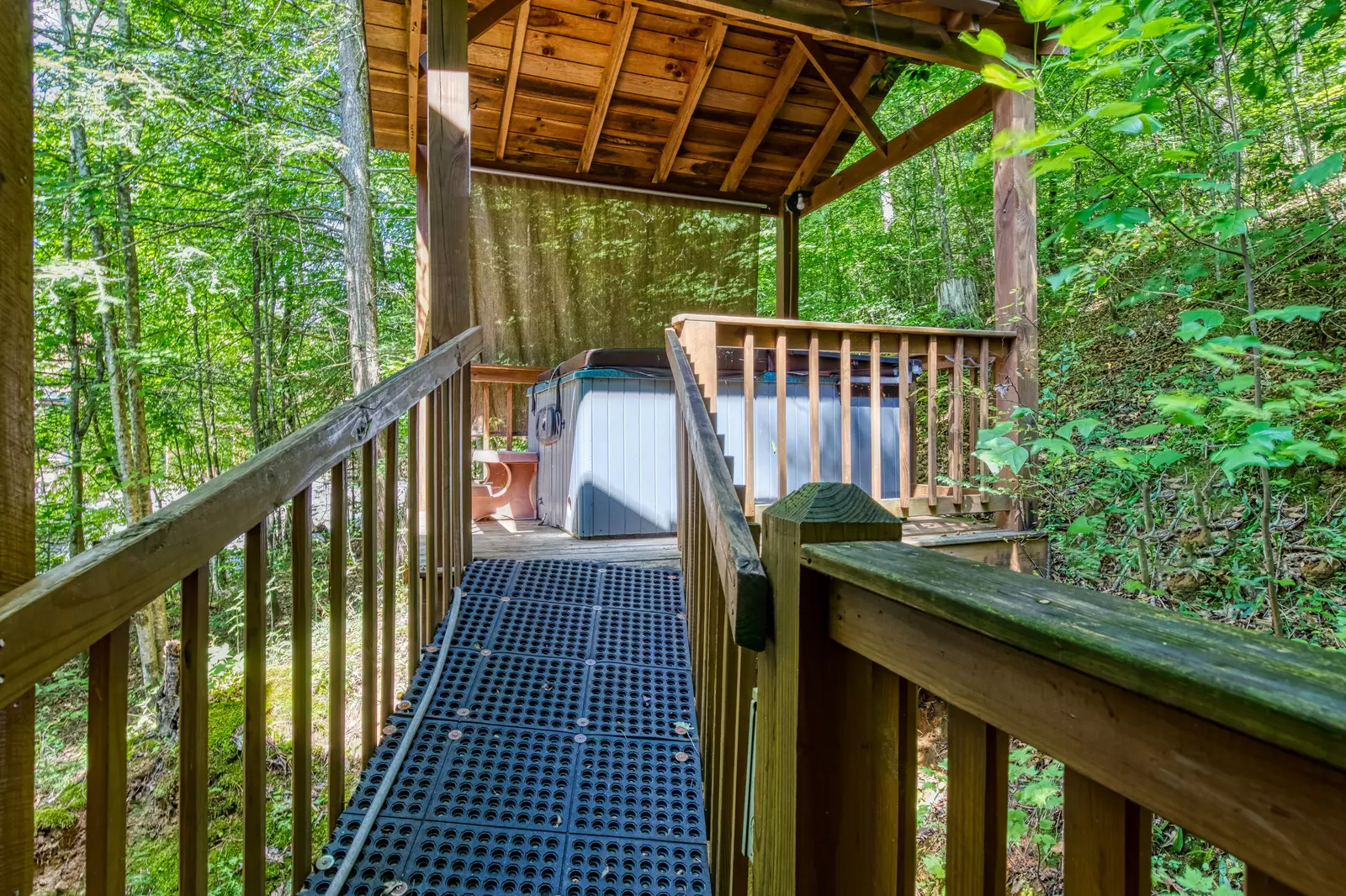 Country Charm covered deck with hot tub