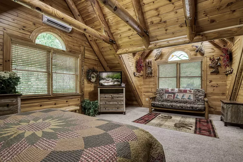 Creekside Lodge - Upper level bedroom with 32-inch TV