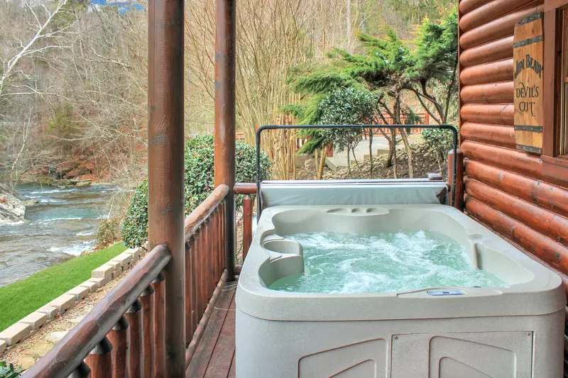 Creekside Lodge lower level covered deck hot tub