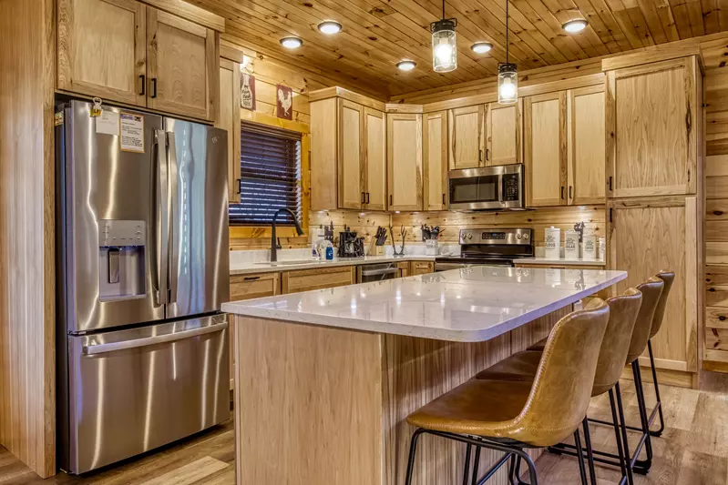 Cozy Cub Cabin fully furnished kitchen and kitchen island